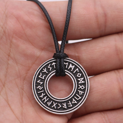 Rune coin amulet on wax rope