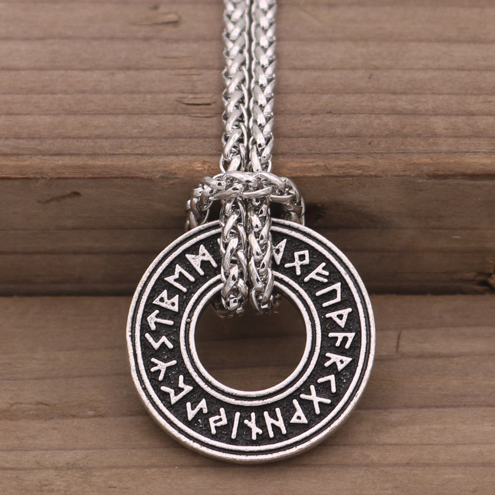 Rune coin amulet in hand