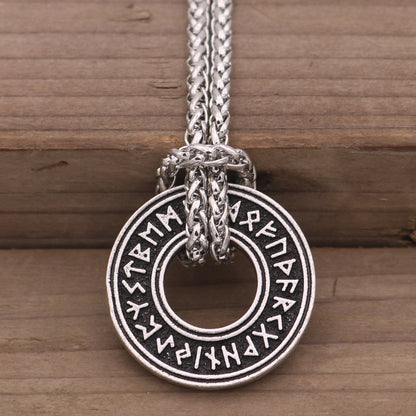 Rune coin amulet in hand