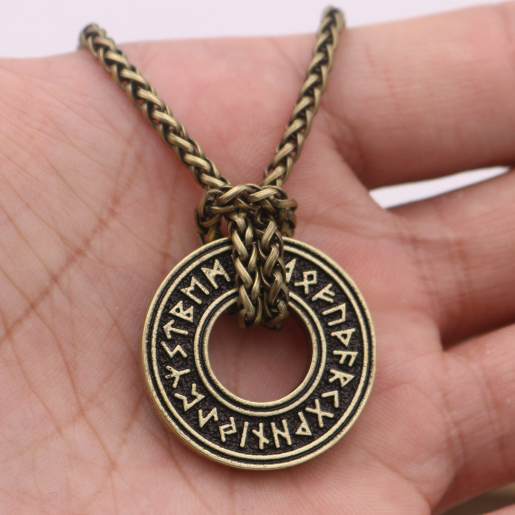 Rune coin amulet — aged bronze