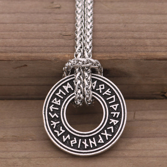 Rune coin amulet — antique silver on chain